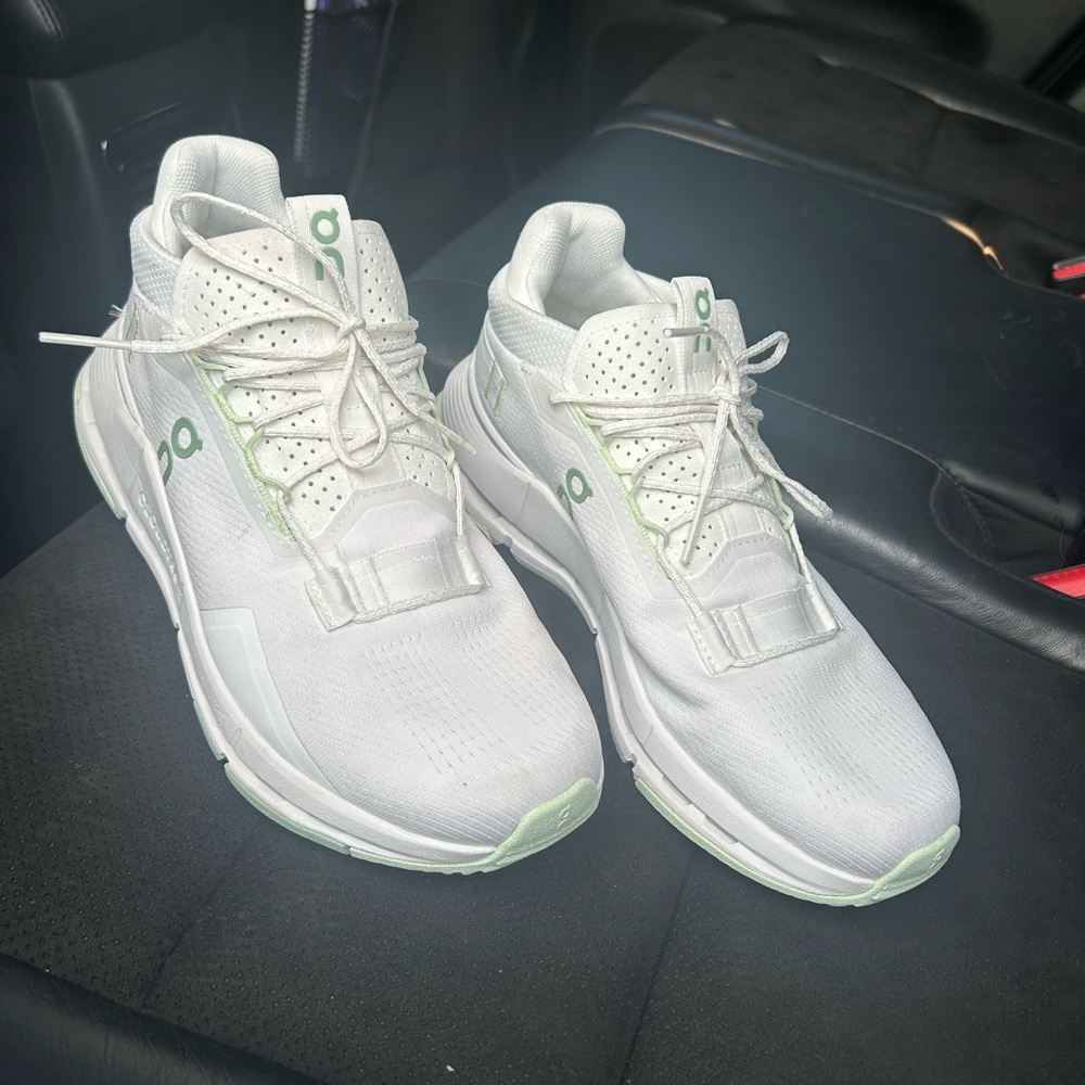 On Running White and Light Green Athletic Shoes